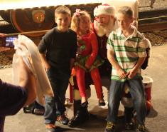 Santa poses with children